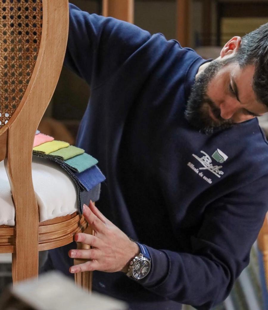 Craftsman selecting fabric